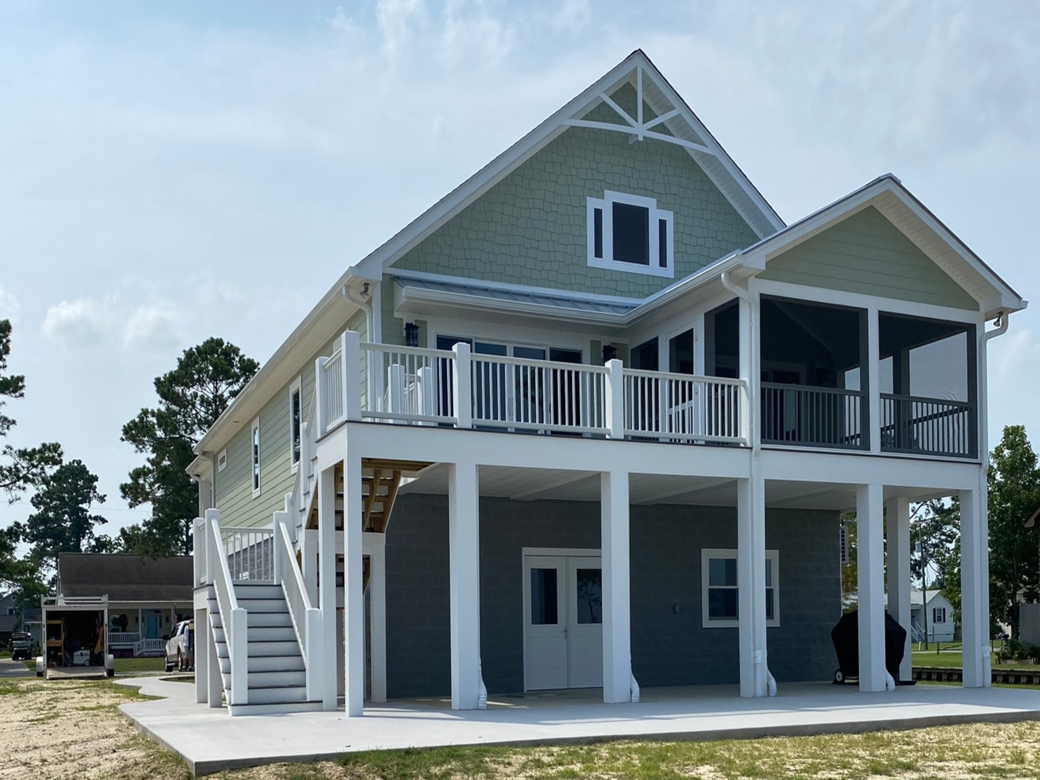 A new home with the exterior painted blue and white by Hudnell Painting